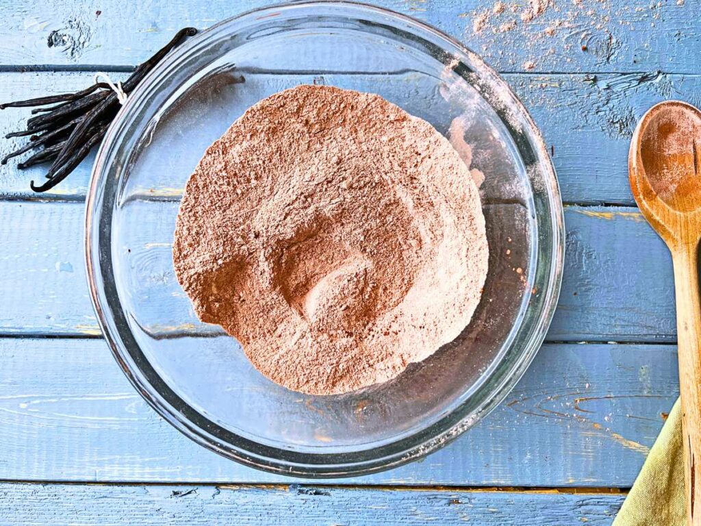 Flour, cocoa, salt, and baking powder in a glass bowl.