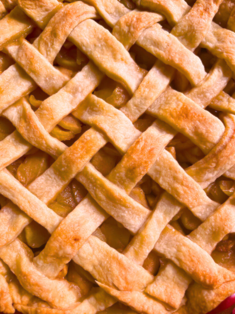A cooked apple pie with a lattice work top crust