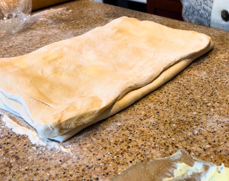 Scottish butter roll dough folded in thirds.