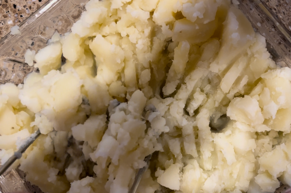 Mashed potatoes in a square glassed casserole dish