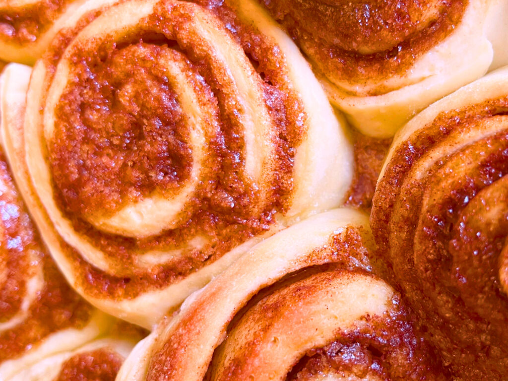 A close up look at baked cinnamon rolls without icing