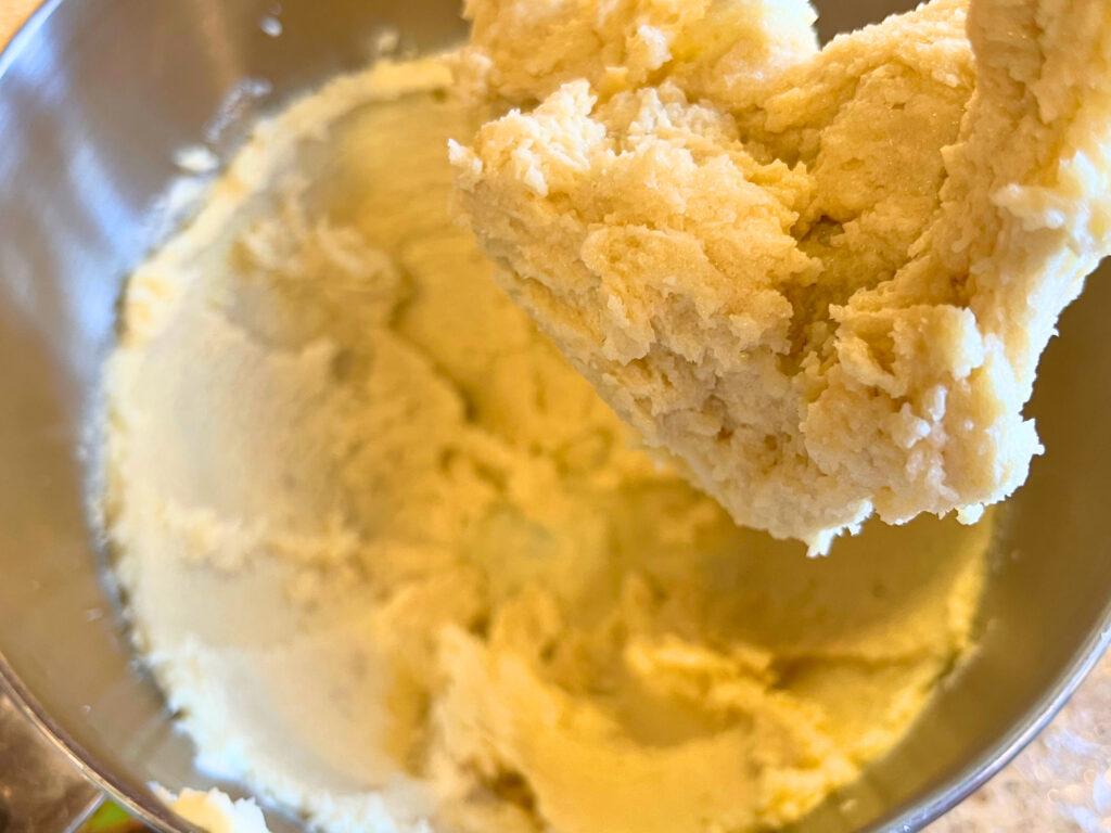 Creamed butter and sugar in the bowl of a stand mixer with the paddle attachment.