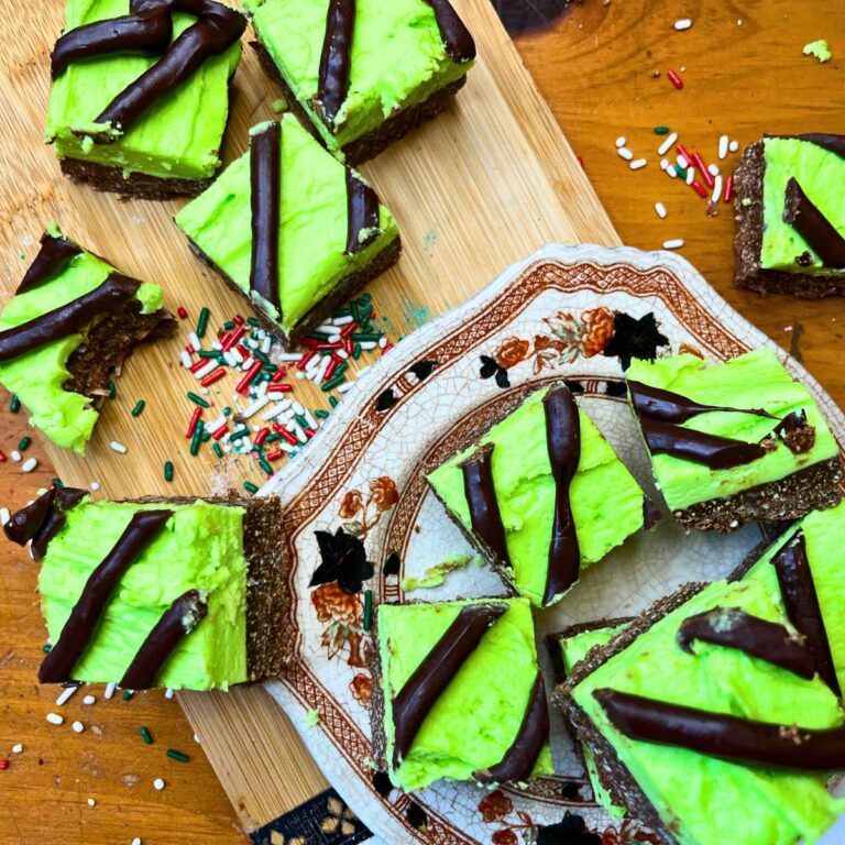 Mint chocolate bars on a brown floral plate. There are some on a wooden platter.