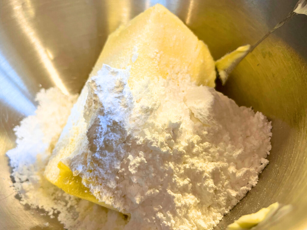 Butter and sugar in the bowl of a stand mixer.