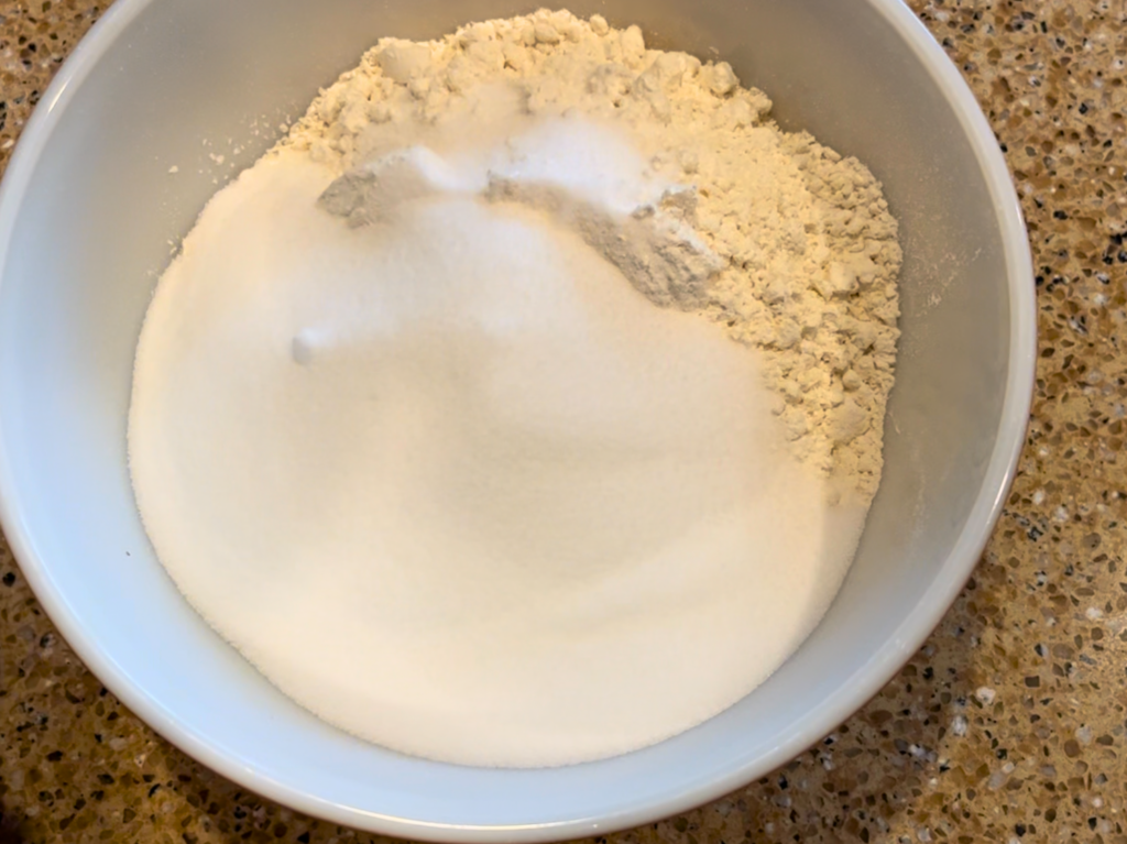 A bowl with flour and salt in it.