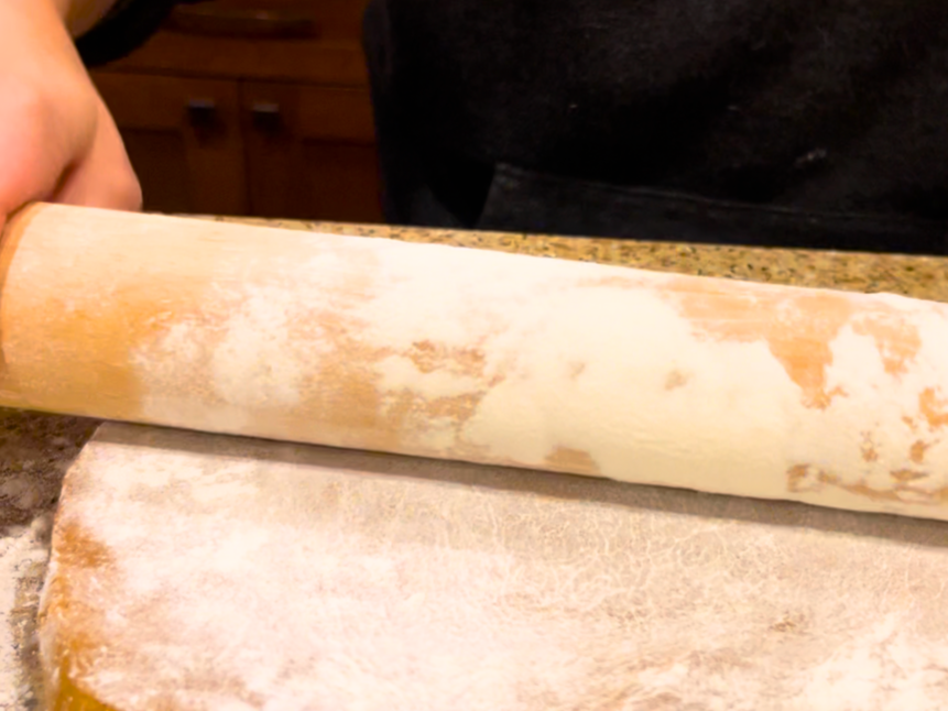 Woman rolling out gingerbread dough