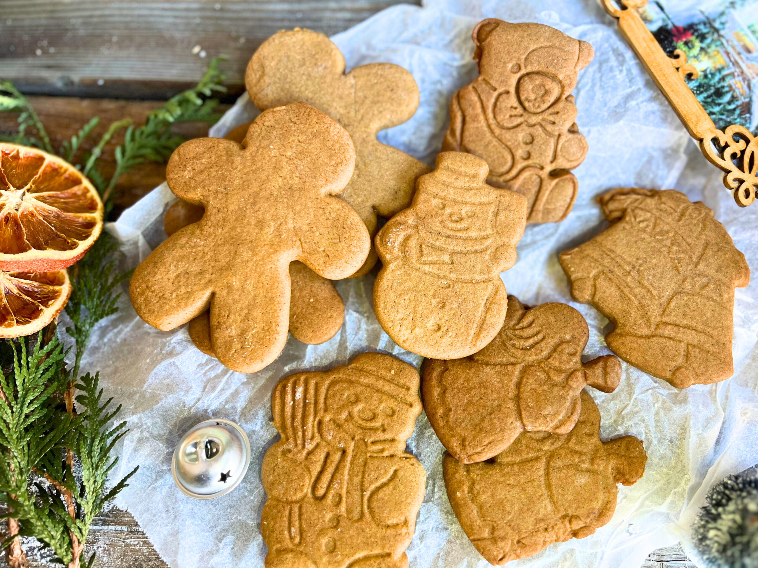 gingerbread cut-out cookies on a piece of parchment paper