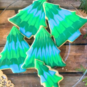 Christmas tree cookies decorated with royal icing.