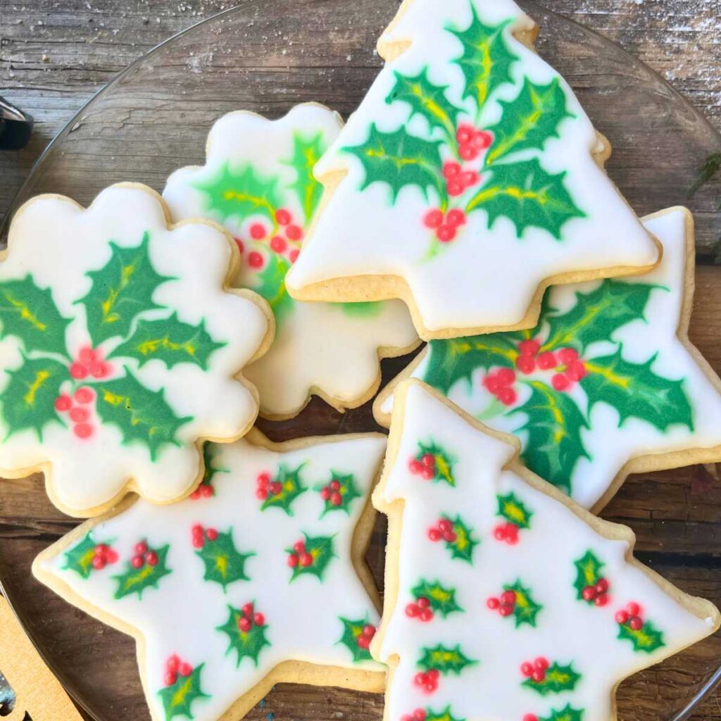 Cookies decorated with holly icing.