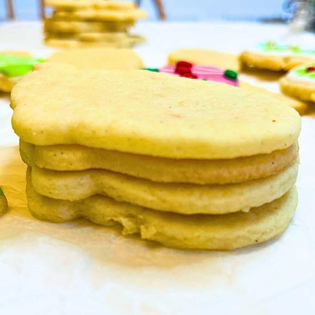 A stack of cut out sugar cookies.