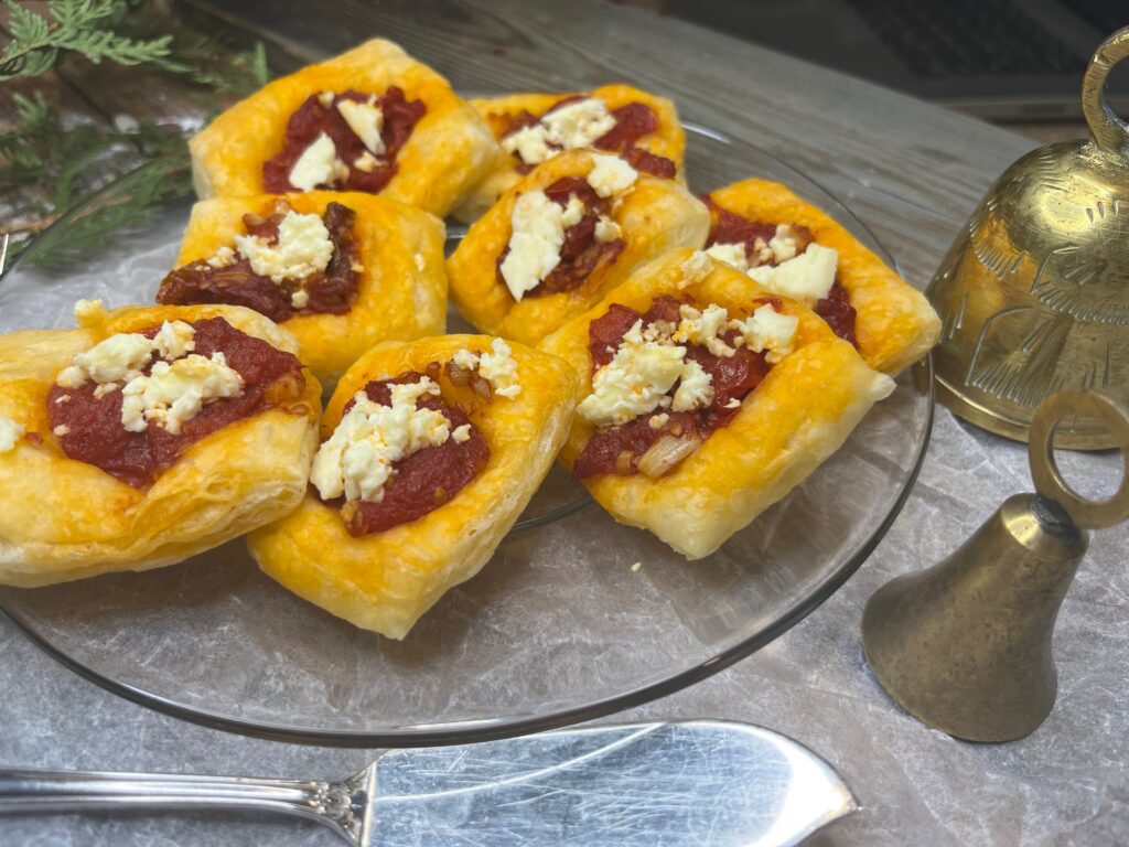A plate of tomato balsamic and feta cheese bites.