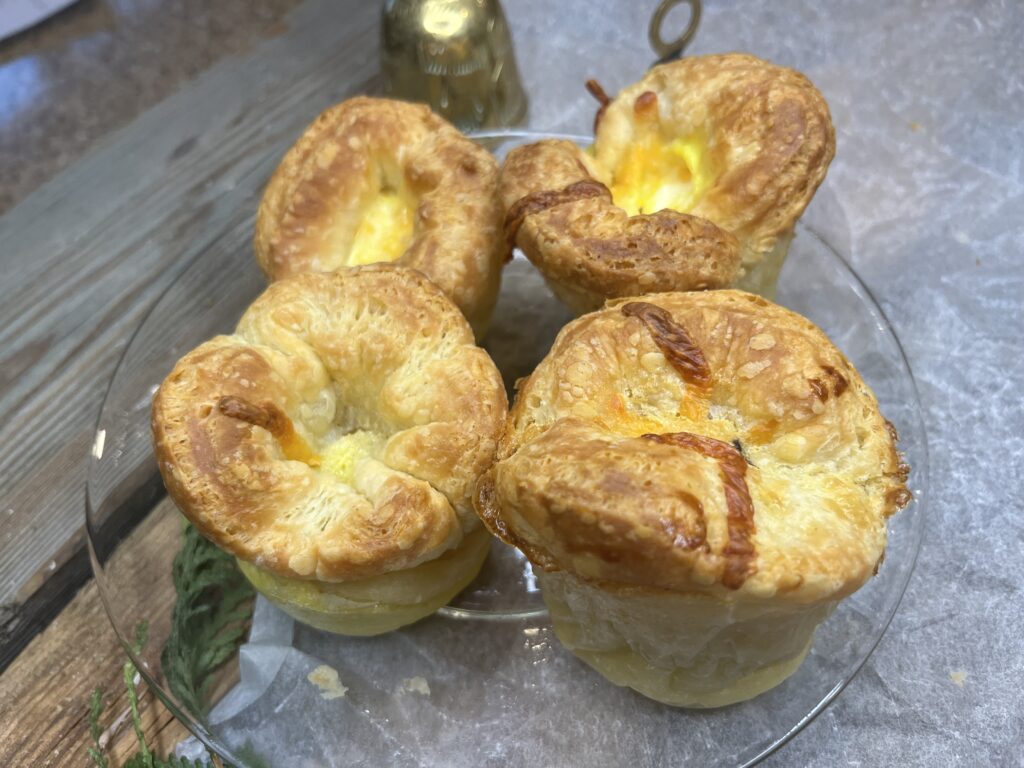 Baked quiche puff pastry muffin cups.
