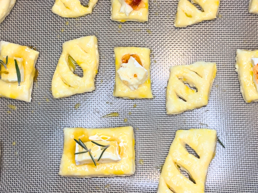 Puff pastry squares with Brie and honey with rosemary and some with Brie and red pepper jelly.