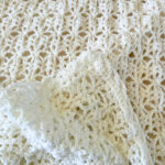 A white crochet blanket.