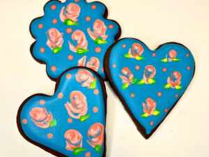 Chocolate cookies with blue icing and pink roses