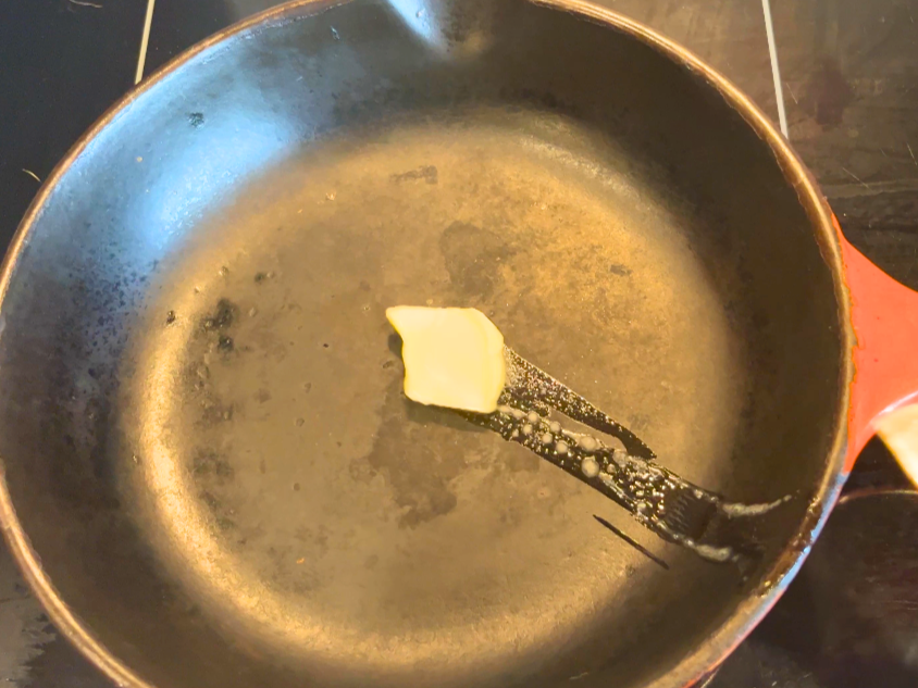 Butter melting in a frying pan.