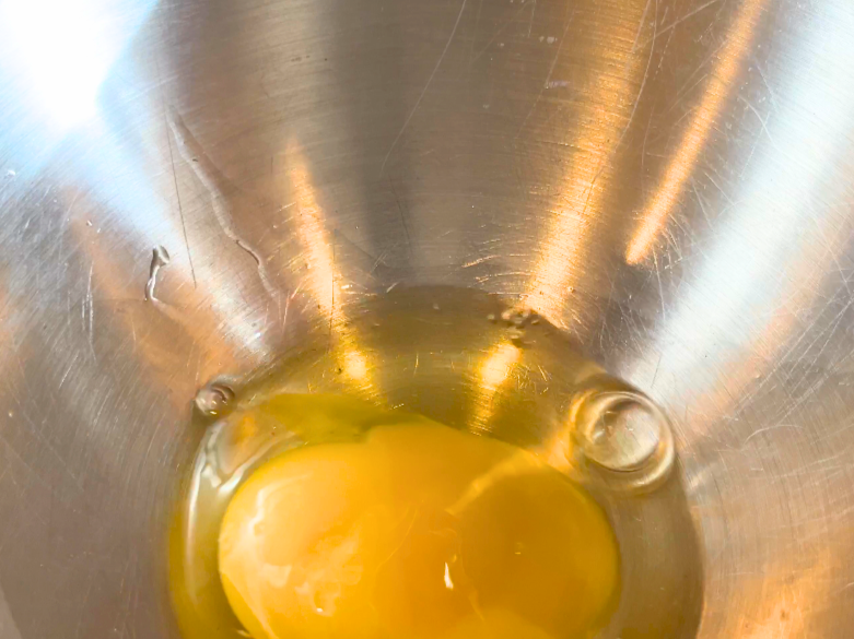 Eggs in the bottom of a mixing bowl