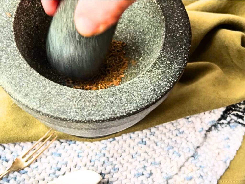 A woman using a mortar and pestle