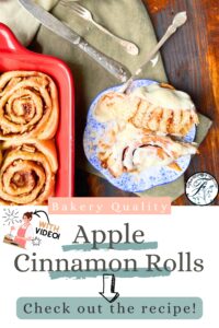 A pinterest pin for Apple Cinnamon rolls. In the picture there is a red casserole dish with cinnamon buns inside. Beside is a blue floral plate with a cinnamon roll that has been cut in half. There is white icing on top.