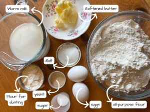 Ingredients out on a wooden table. The ingredients are labeled and have arrows pointing to them.