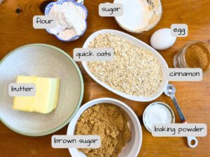 There is a wooden table full of ingredients. They are labeled.