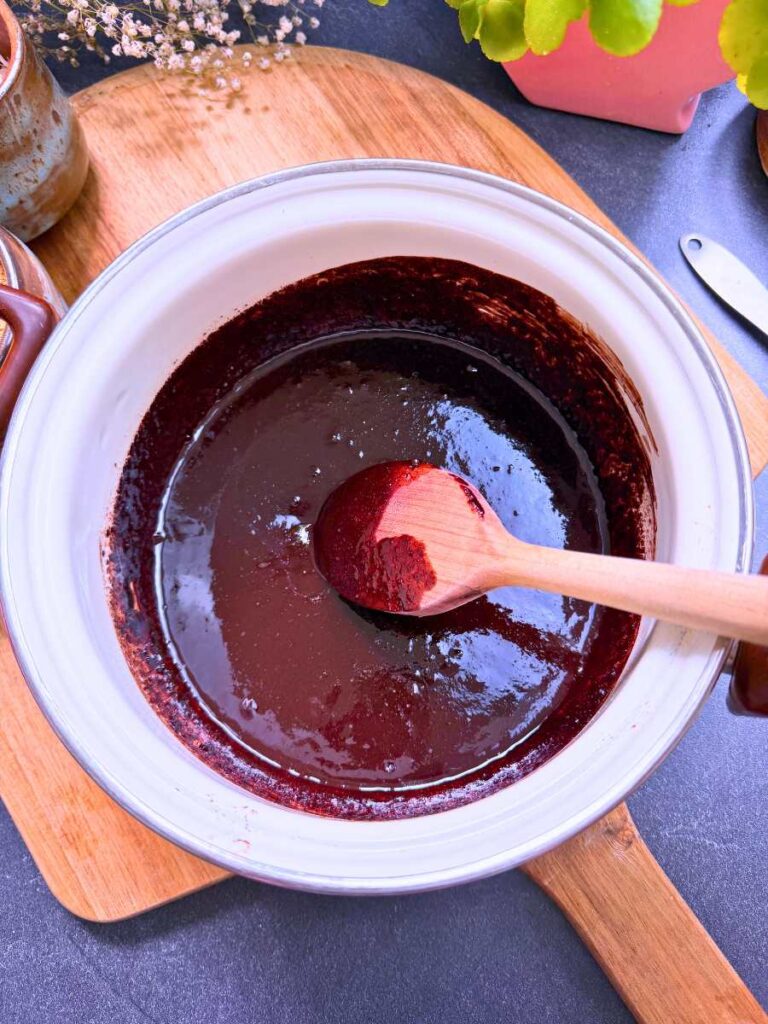 Melted chocolate in a white sauce pot.