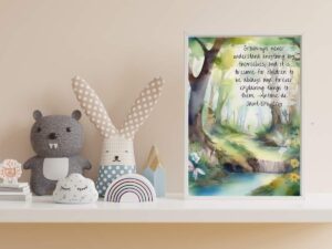 A child's room shelf with toys and an art frame with a vintage quote and art print in it.