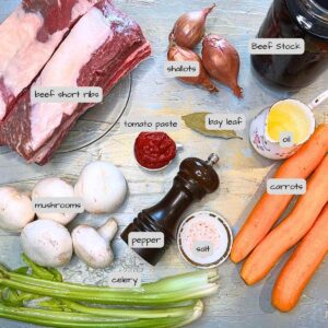 A table full of ingredient for stew. The ingredients are labeled.