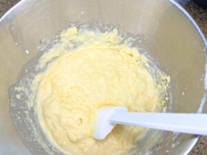 A mixing bowl with pancake batter inside.