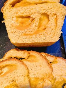 Some slices of cheese bread. Showing the inside of the loaf of bread with swirled of cheese inside.