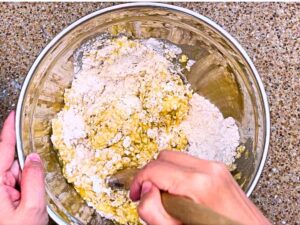 A woman mixing muffin batter.