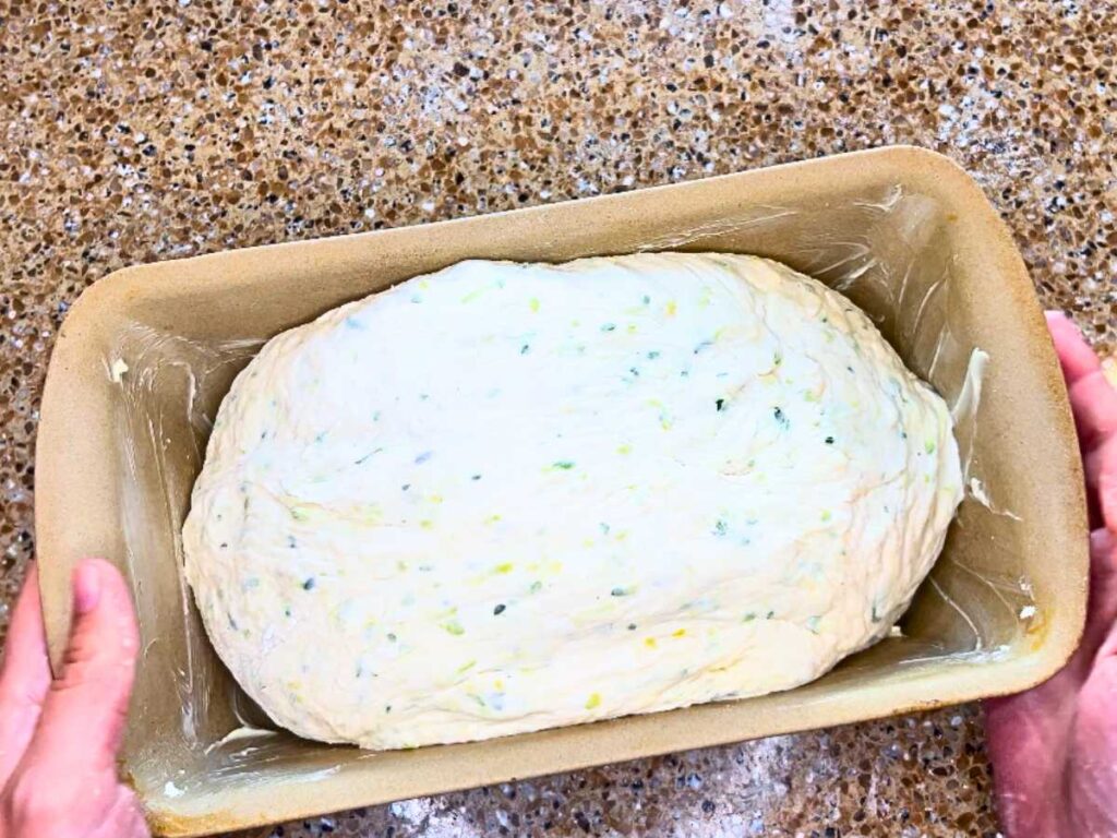 Vegetable bread dough in a bread pan.