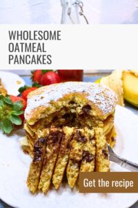 A pinterest pin with a stack of oatmeal chocolate chip pancakes. There are bananas and strawberries in the background.