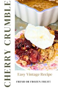 A pinterest pin. There is a cherry crumble with whipped cream on top. There is more of the crumble in the background.