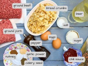 There are meatloaf ingredients on a blue table. They are labeled.