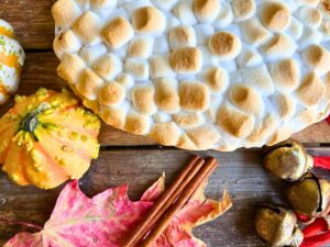 A cooked sweet potato casserole with a marshmallow top.