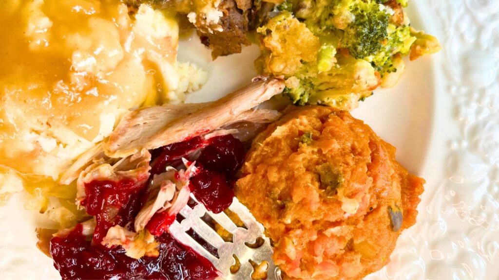 A plate full of thanksgiving food.