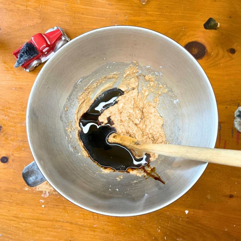 A metal bowl with shortening, sugar, and molasses inside.