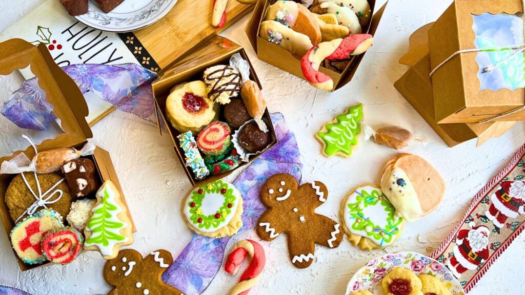 Christmas cookies packaged in small cardboard treat boxes.