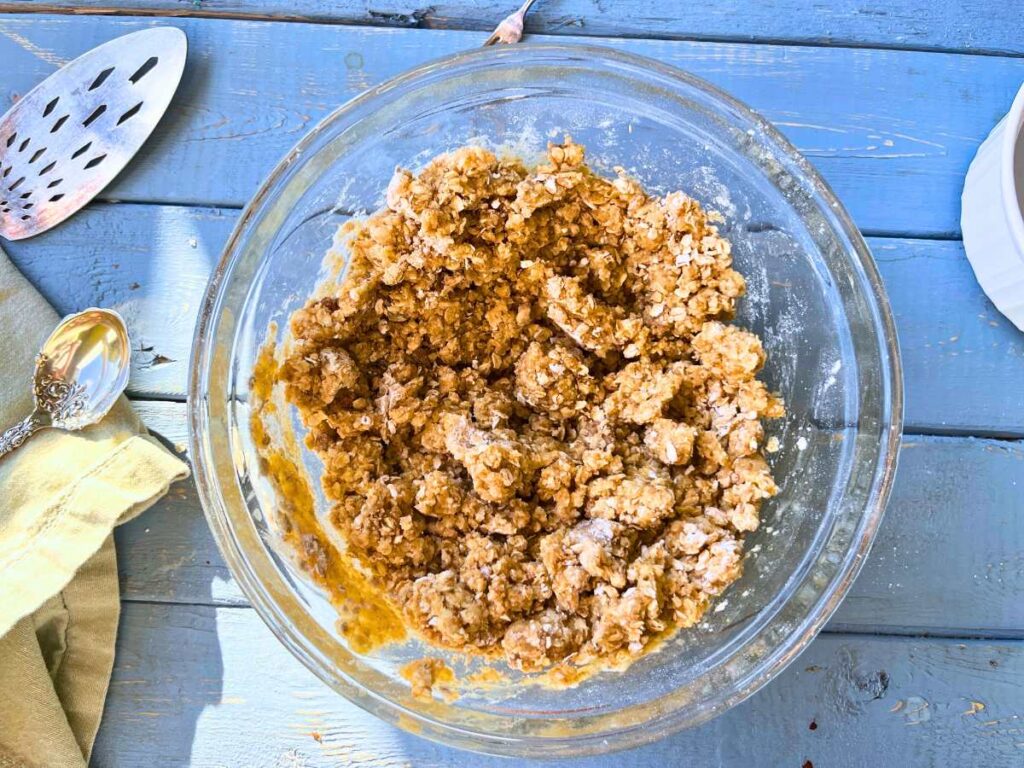 A crumble mixture in a glass bowl.