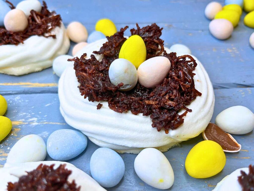 A meringue nest filled with chocolate and candy meringue eggs.