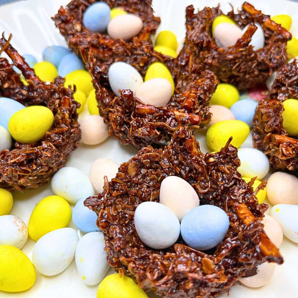 A collection of chocolate nests filled with mini candy eggs.