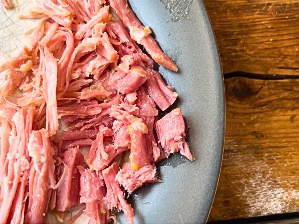 A plate with cut salt pork meat.