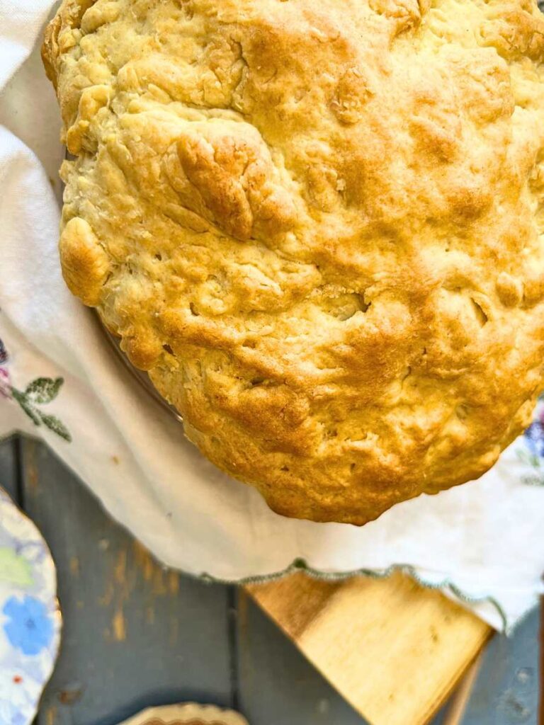 A close up overhead view of a loaf of bannock bread.