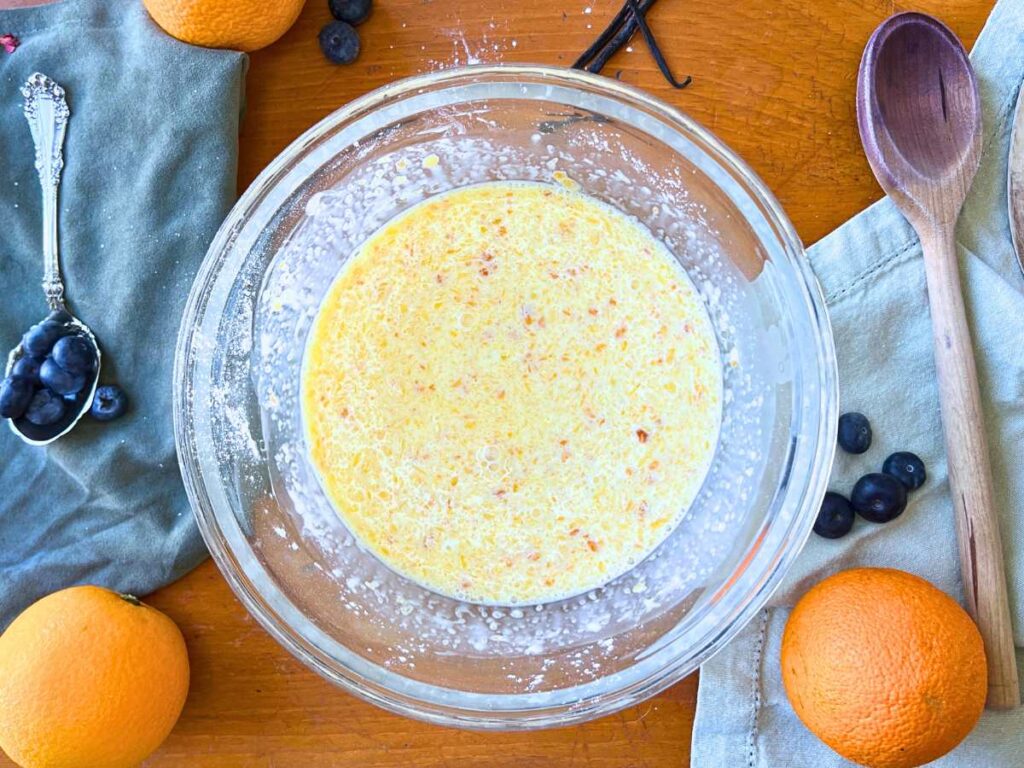 Crêpe batter in a glass bowl.