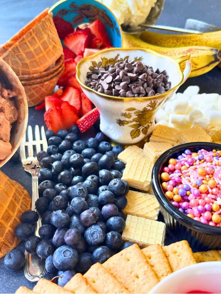 A table of ice cream sundae toppings.