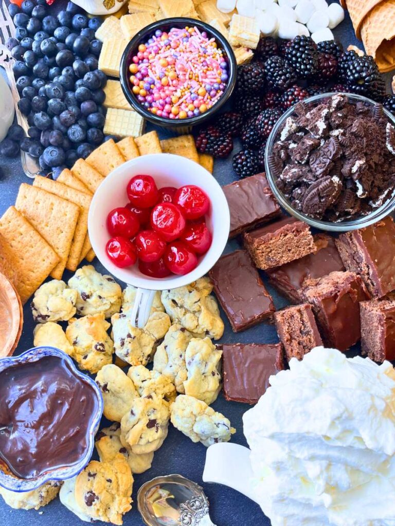 A table full of ice cream sundae toppings.