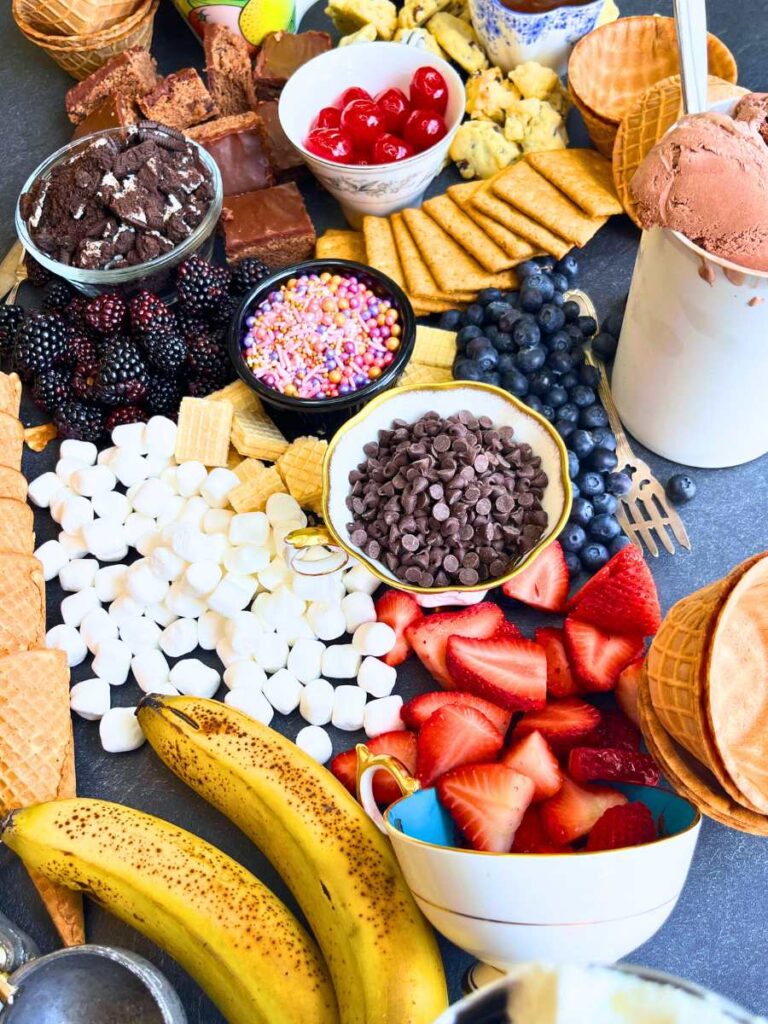 A table full of ice cream toppings.