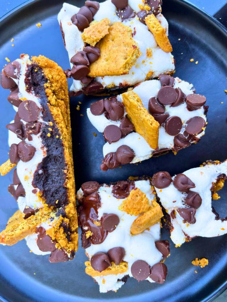 A black plate with s'mores themed dessert bars.