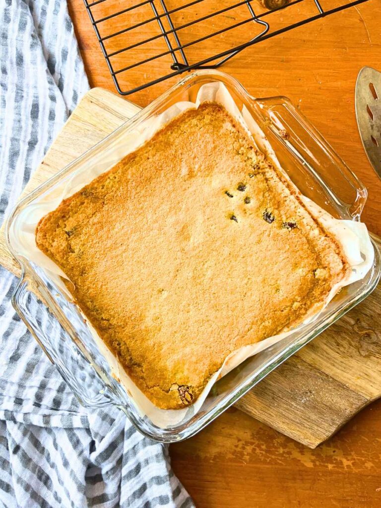 A glass pan with baked butter tart squares inside.